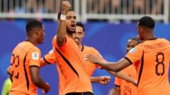 cover-8100-1782000064jpg - 實發體育 Orange-clad soccer players celebrate on the field, one raising a fist in triumph after a play.