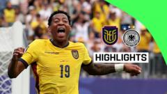 Soccer player in a yellow jersey with number 19 celebrates with fists raised on the field during a highlights montage, with a green corner label reading HIGHLIGHTS.
