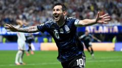 cover-8750-1784167222jpg - 實發體育 Soccer player in a blue kit with arms outstretched, celebrating a goal on the field.