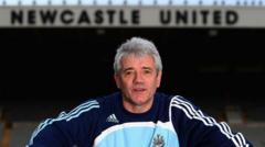 cover-8886-1784599226jpg - 實發體育 Male coach wearing a Newcastle United training jacket stands in front of a stadium with Newcastle United signage above him.