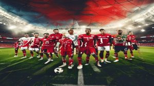cover-8947-1784851260jpg - 實發體育 Soccer team in red jerseys lined up on the pitch with a ball at their feet in a stadium under bright lights.